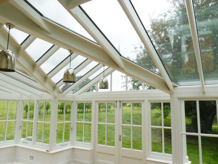 Gable conservatory with 4-pane Georgian detail, thatched cottage