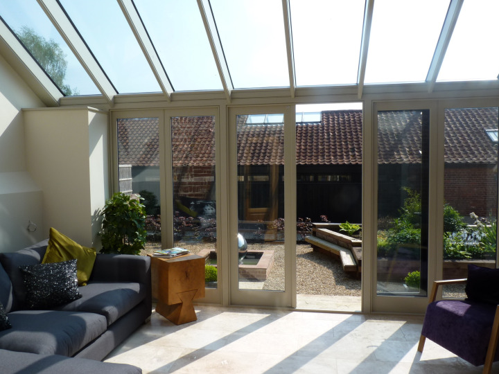 Lean-to Conservatory with double storey roof for a listed barn, Norfolk