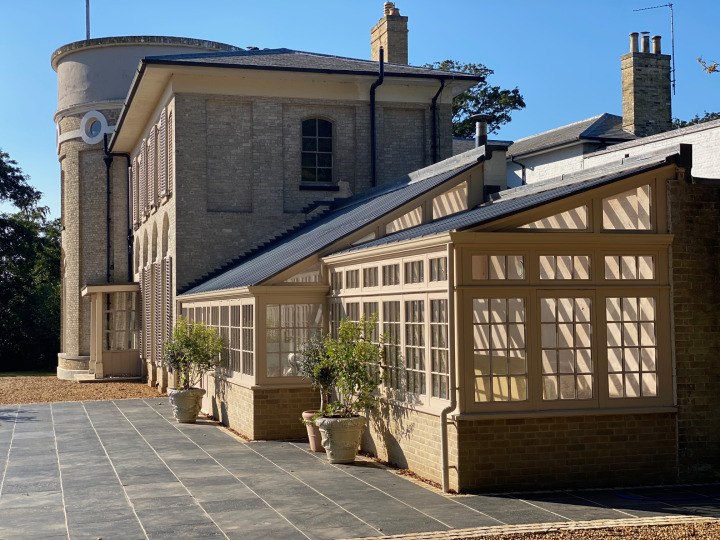 A splendid replacement greenhouse built against a spine wall with lead cappings