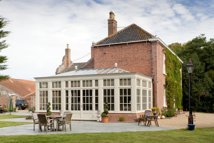 Traditional orangery with Georgian pilasters, French doors & clerestory windows