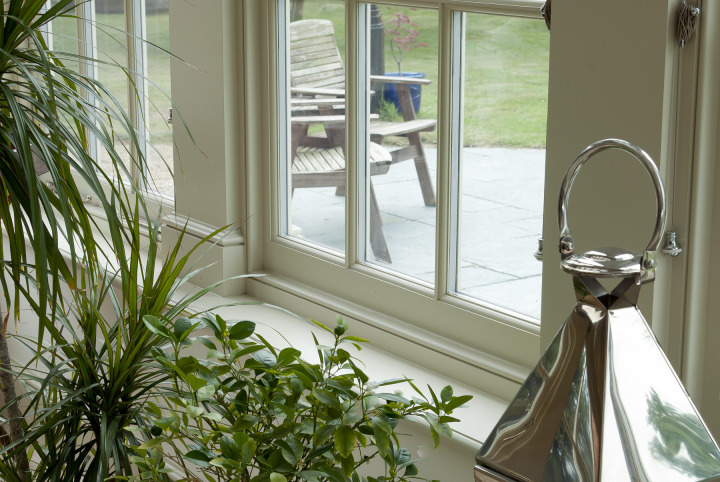 Traditional orangery with Georgian pilasters, French doors & clerestory windows