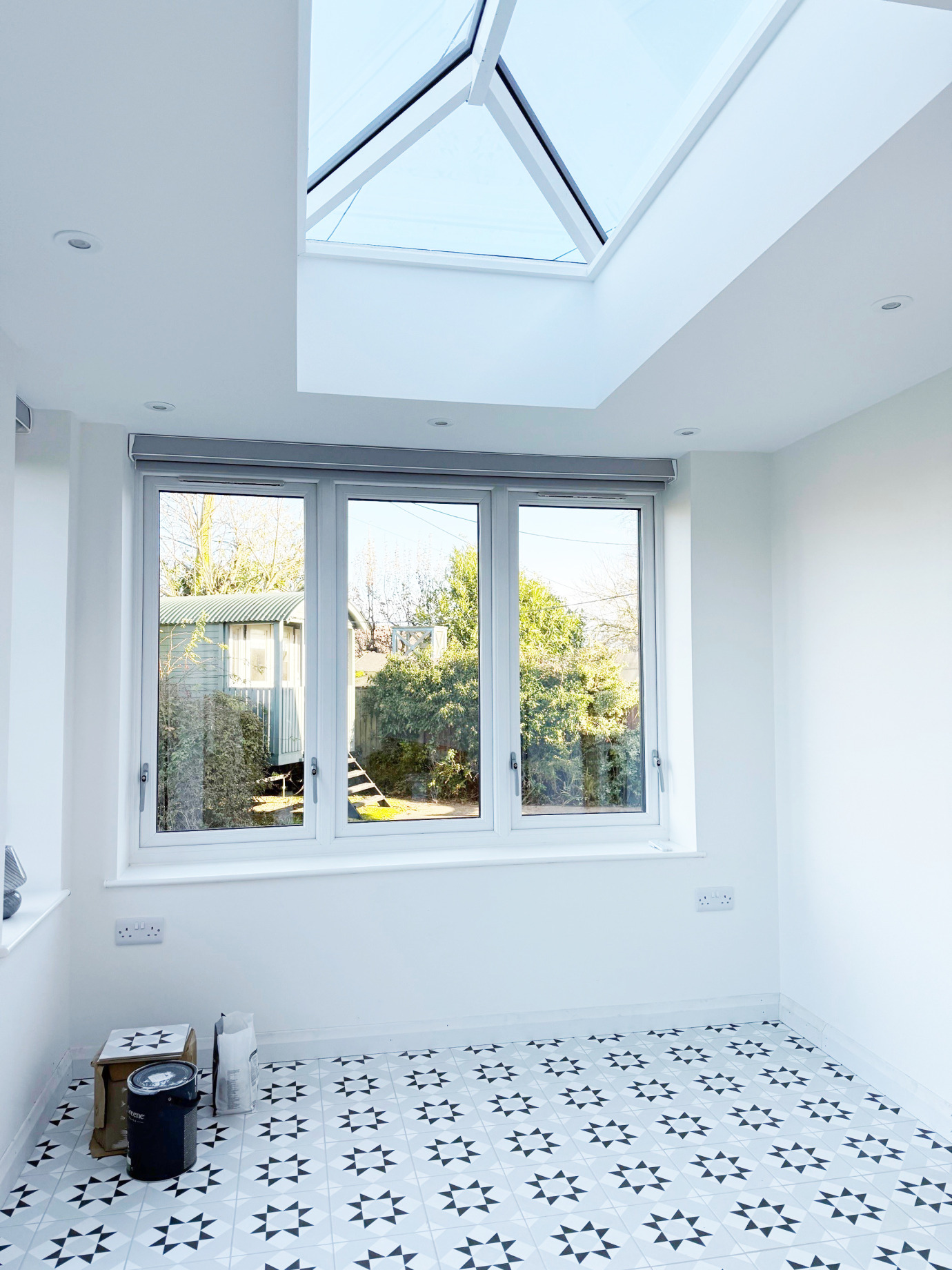 Black-clad contemporary orangery with two lanterns