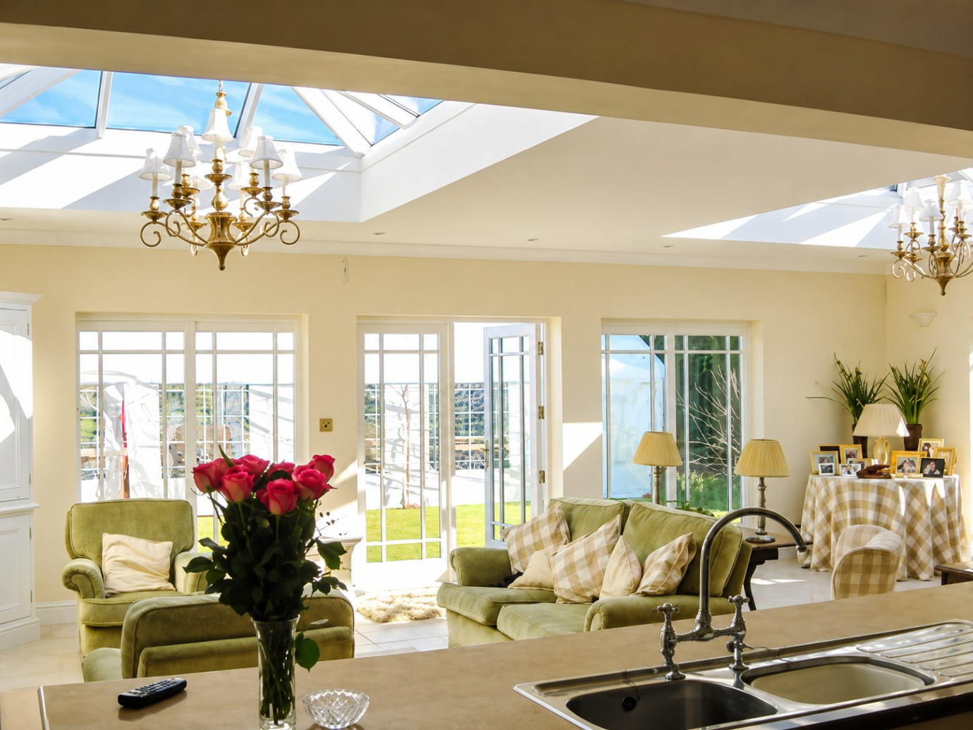 Brick orangery with two roof lanterns, French doors, parapet wall