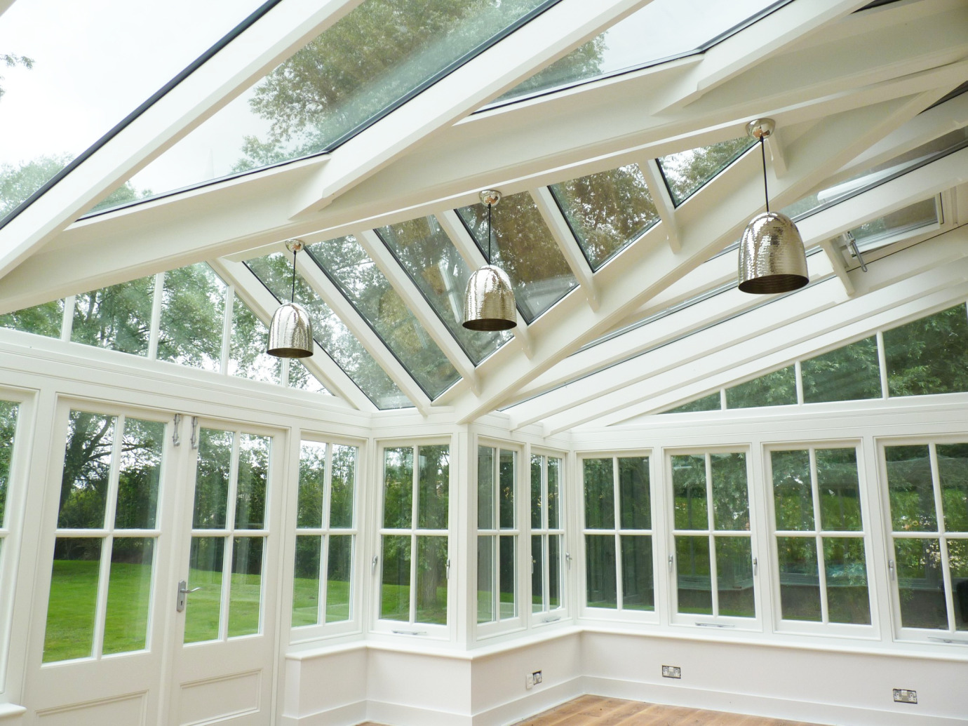 Gable conservatory with 4-pane Georgian detail, thatched cottage