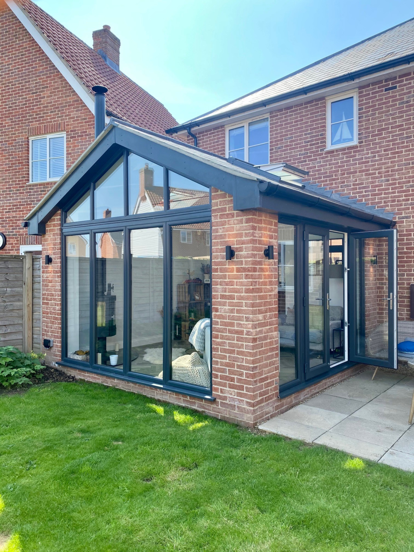 Glazed extension with modern wood burner