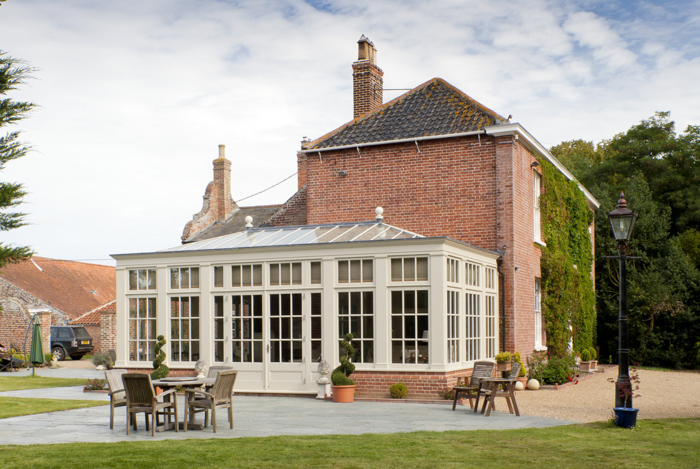 Traditional orangery with Georgian pilasters, French doors & clerestory windows