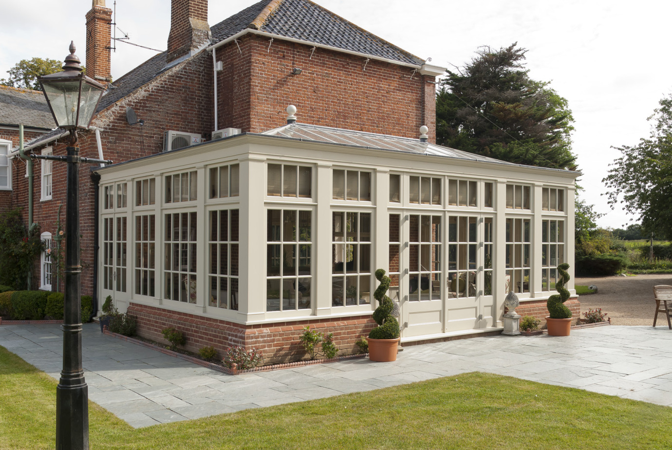 Traditional orangery with Georgian pilasters, French doors & clerestory windows
