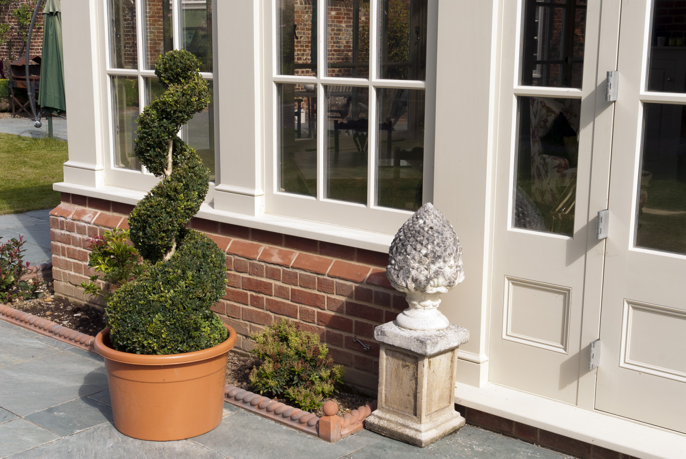 Traditional orangery with Georgian pilasters, French doors & clerestory windows