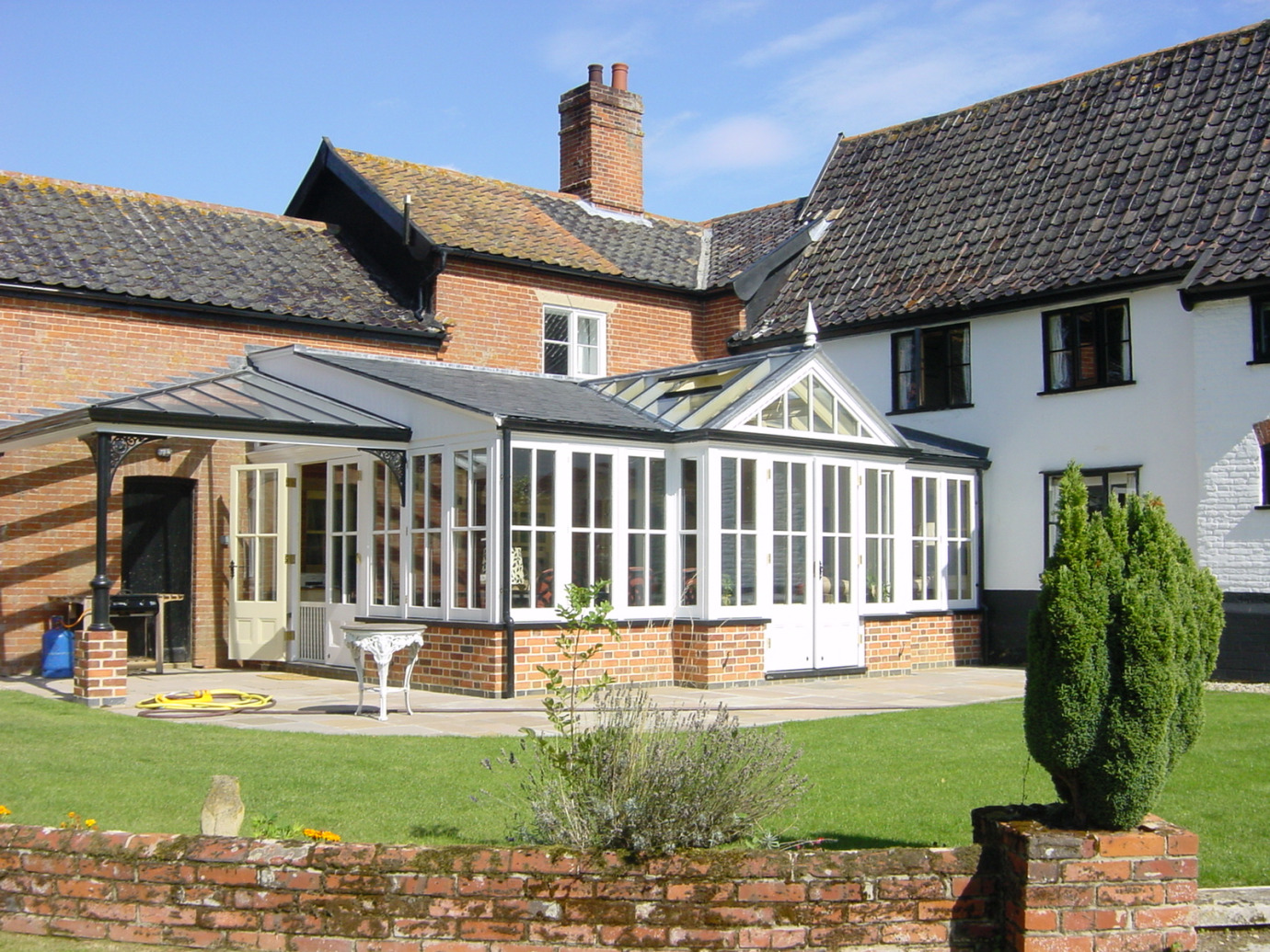 Family room and veranda with slate roof for a period farmhouse
